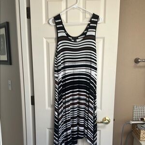 Classic cute summer dress with flattering strips and
Asymmetrical bottom